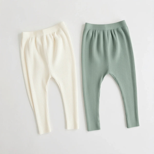 Two pairs of ribbed cotton baby leggings in cream and sage