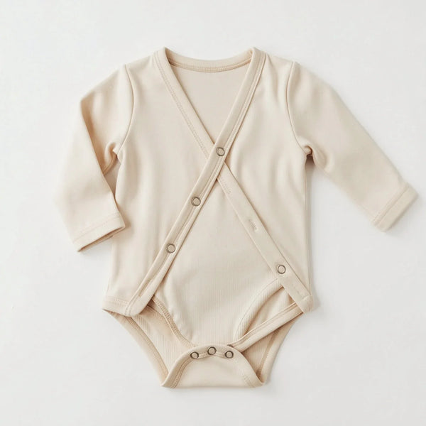 Ivory cotton kimono wrap bodysuit with side snaps