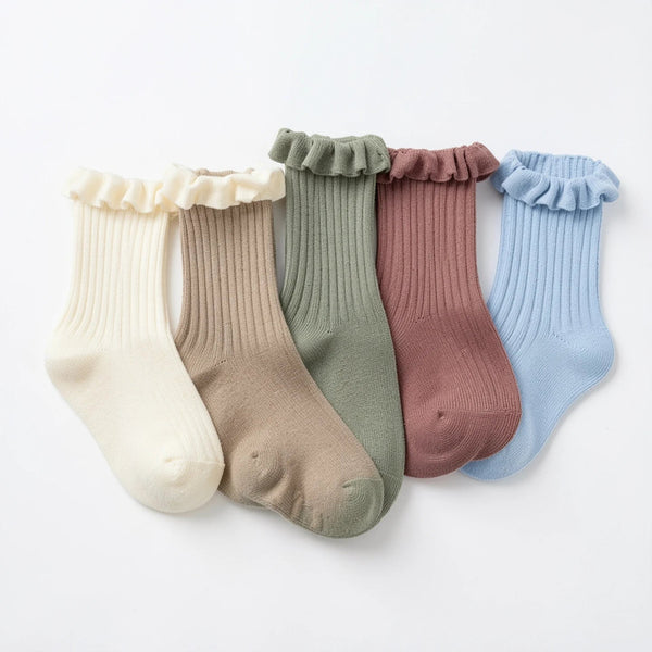 Five pairs of ribbed cotton baby socks in cream, oatmeal, sage, dusty rose and soft blue