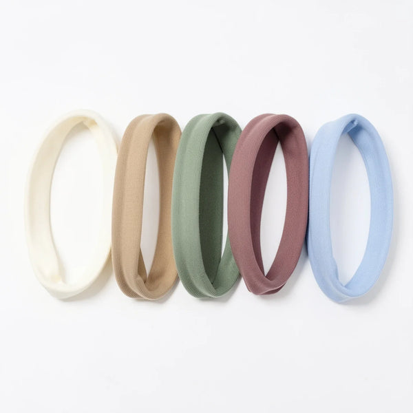 Five plain soft baby headbands in cream, oatmeal, sage, dusty rose and soft blue