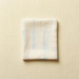 A folded muslin cloth, representing fulfilment from the United States